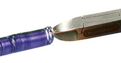 Wire cutters cutting coil of wire